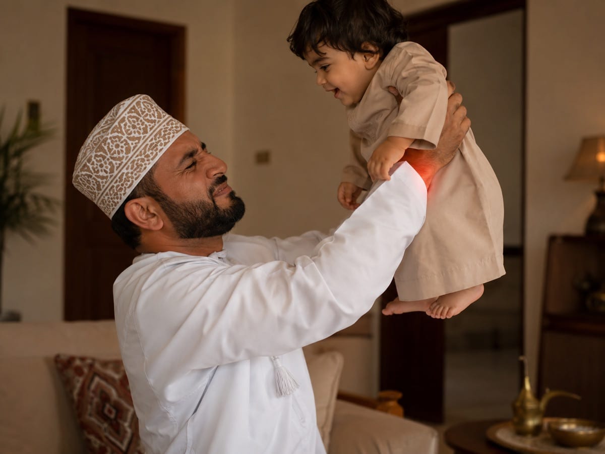 A parent lifting a child and wincing at thumb-side wrist pain, classic de Quervain's.